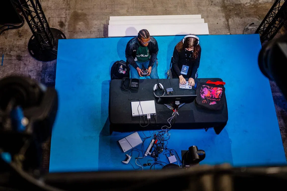 Fighting game enthusiasts compete during the EVO France 2025 fighting game tournament in Nice.