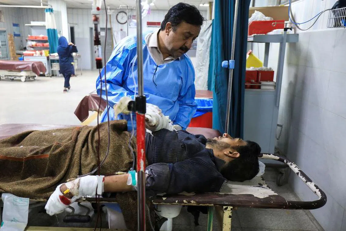 A police officer, who was injured after a bomb blast on polio vaccination guard duty in the Bajaur tribal district, receives first aid at a hospital in Peshawar, Pakistan January 8, 2024. REUTERS/Fayaz Aziz