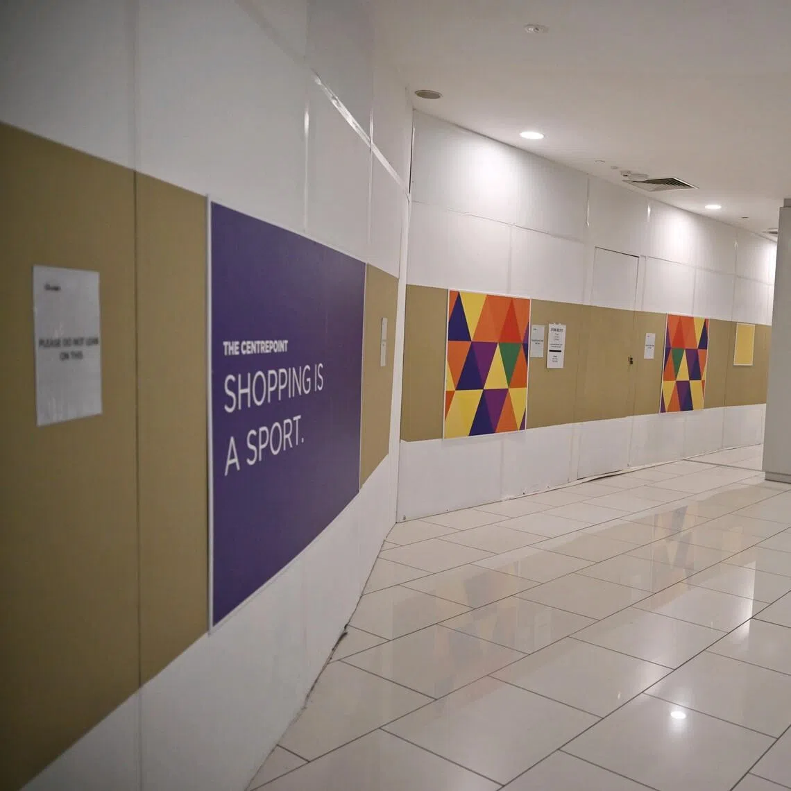 Hoardings and
 for-rent signs at
 The Centrepoint
shopping mall on
 Feb 18.
