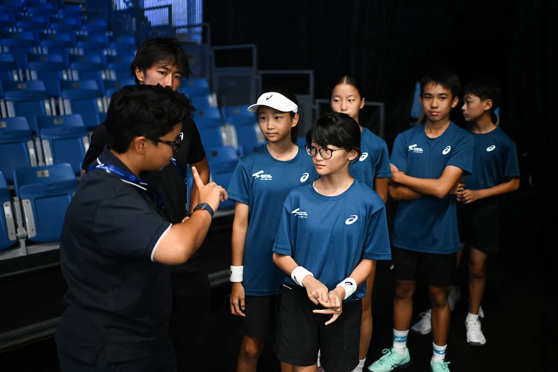 83 students from the Singapore Tennis Association have participated as ball kids for the Singapore Tennis Open this year. Under the 2026 Singapore Ball Kids Programme (WTA 500 Singapore Open), they train three times a week for a month ahead of the tournament.

ST PHOTO: AZMI ATHNI