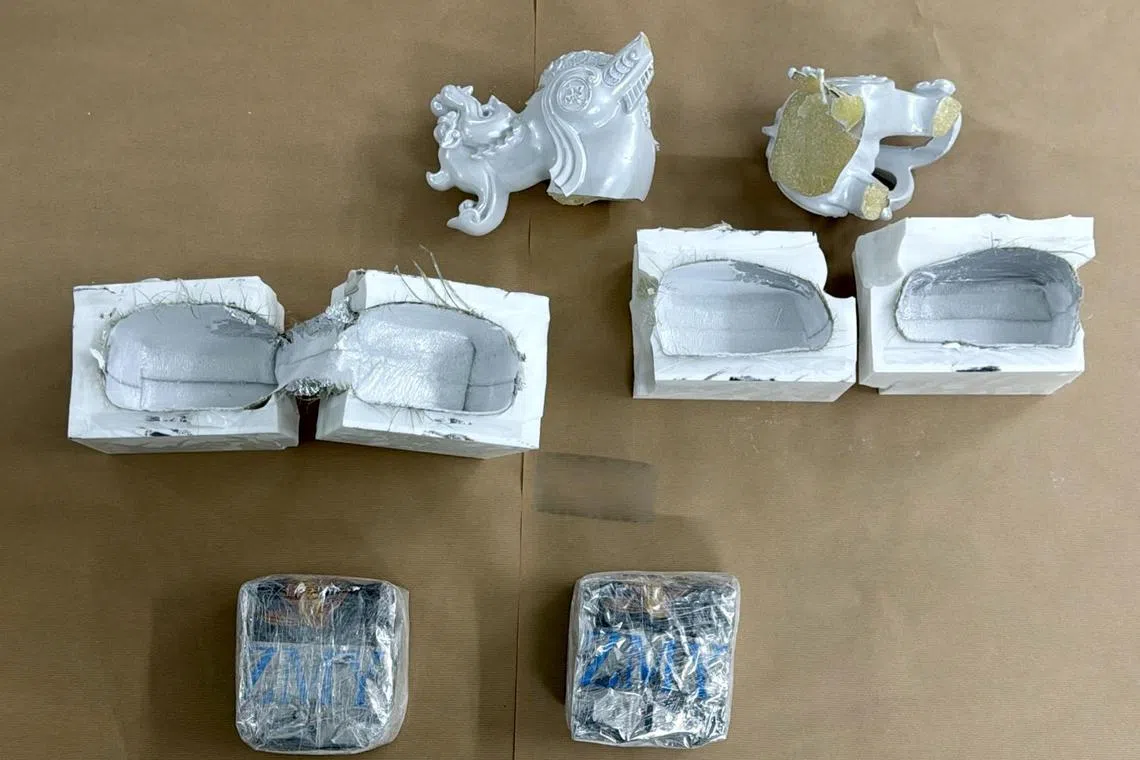 About 4.15kg of Ice was found hidden within the base structures of two ornamental lion figurines.