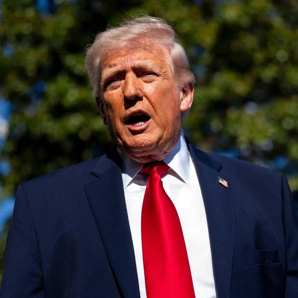 US President Donald Trump speaking to the media outside the White House on April 11, before boarding Marine One.