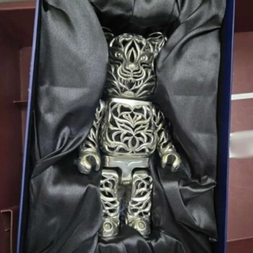 (Clockwise from left) A pewter Bearbrick collectible figurine, fishing lures intended for commercial purpose and luxury bags and jewellery were among the items offenders tried to bring into Singapore undeclared.