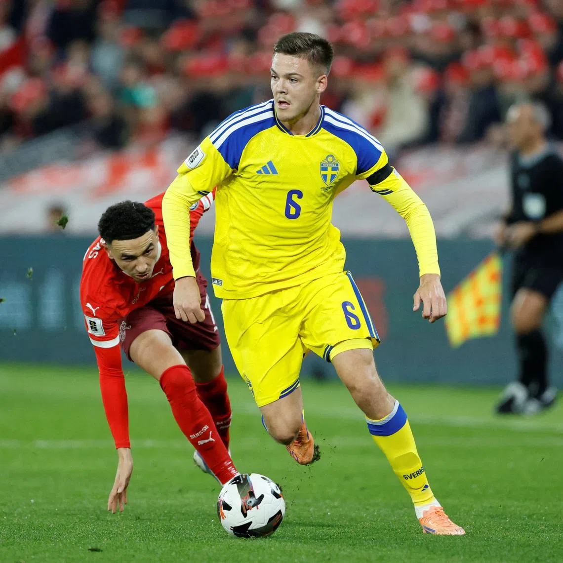 FILE PHOTO: Soccer Football - FIFA World Cup - UEFA Qualifiers - Group B - Switzerland v Sweden - Stade de Geneve, Geneva, Switzerland - November 15, 2025 Sweden's Emil Holm in action with Switzerland's Ruben Vargas REUTERS/Stefan Wermuth/File Photo