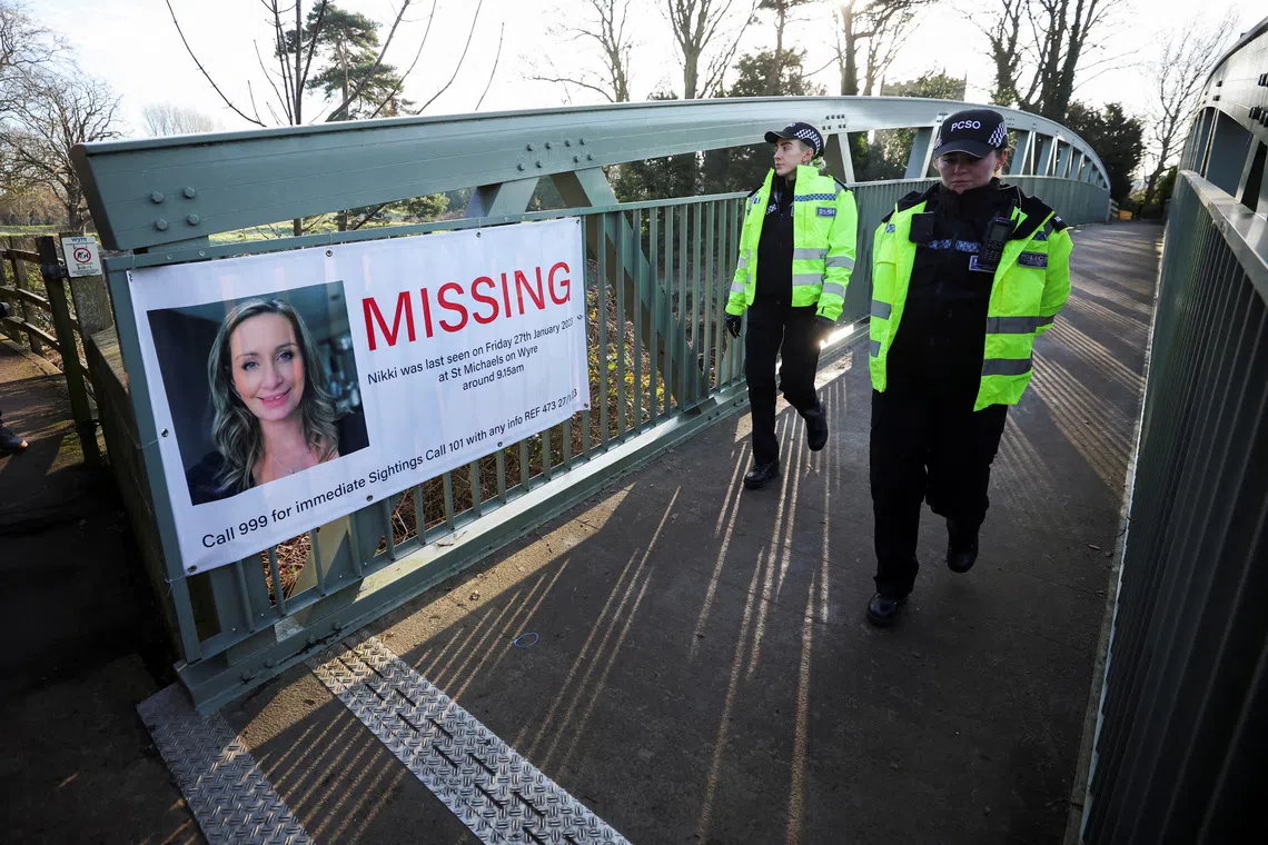 Police officers walk as they search the River Wyre for Nicola Bulley on Feb 6, 2023.