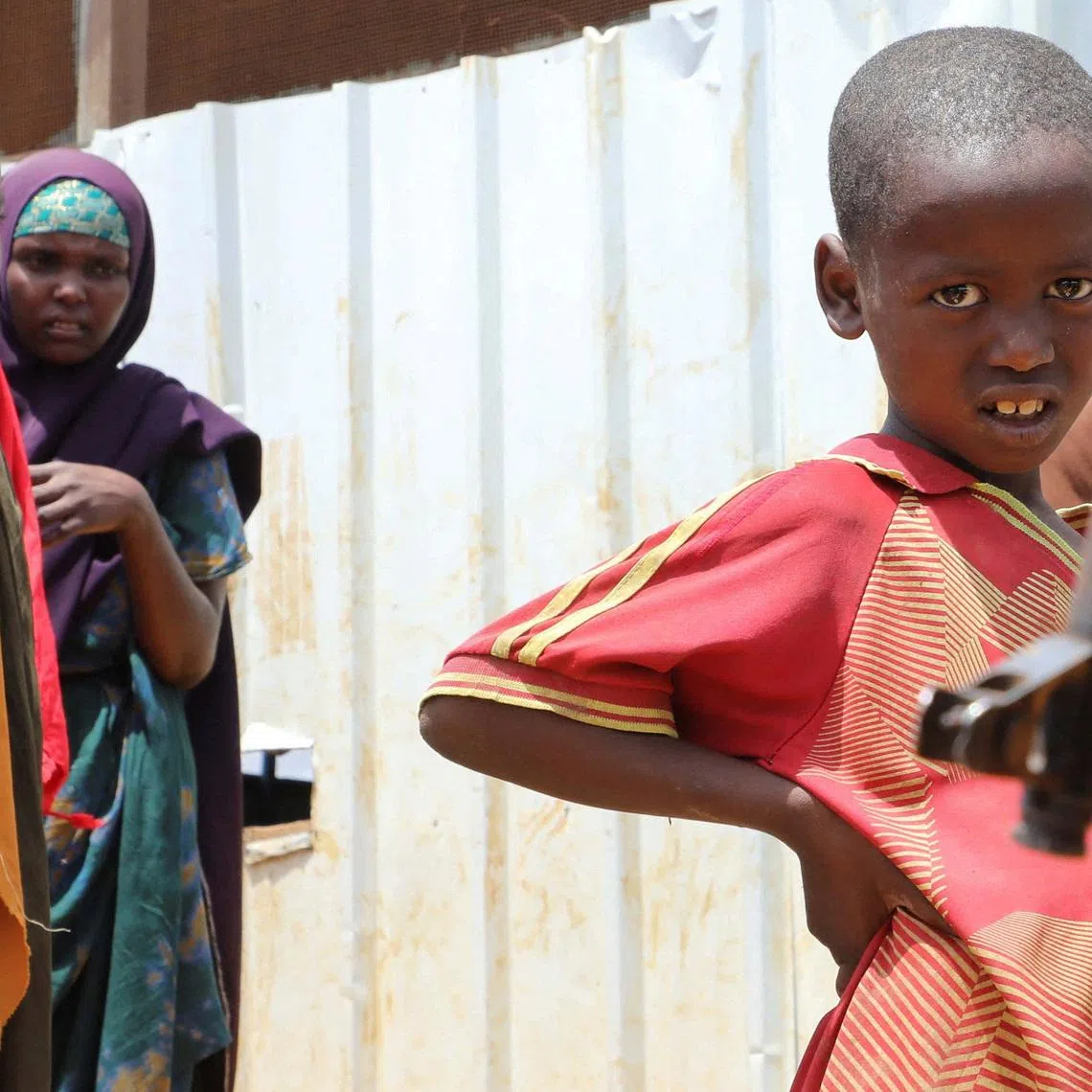 FILE PHOTO: A security officer stands guard as the United Nations (UN) Under-Secretary-General for Humanitarian Affairs and Emergency Relief Coordinator Tom Fletcher (not in the picture) visits a camp for the internally displaced Somali people, as shortages of lifesaving therapeutic foods caused by shipping disruptions due to the Iran war have forced clinics treating severely malnourished children to turn away patients and ration supplies in drought-hit Somalia, in Baidoa, Somalia April 29, 2026. REUTERS/Feisal Omar/File Photo