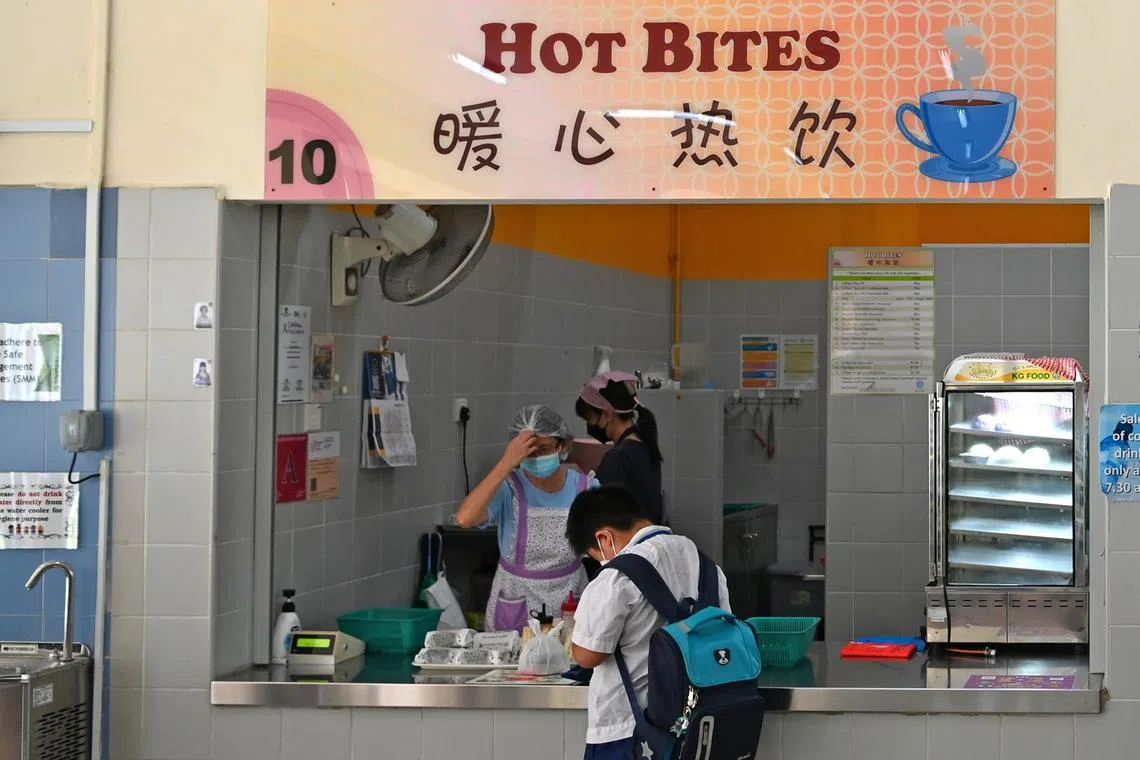 Primary school student at the school canteen in Mee Toh School, 23 March 2022.