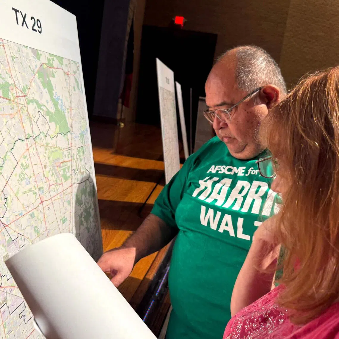 Voters look at a map to understand the new redistricting maps approved by Texas lawmakers for the 2026 midterm elections, in Houston, Texas, on Aug 27.