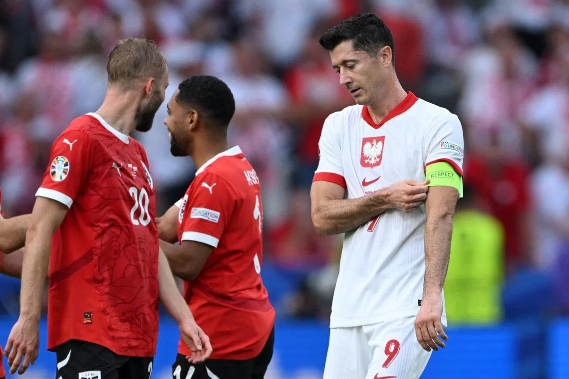 Soccer Football - Euro 2024 - Group D - Poland v Austria - Berlin Olympiastadion, Berlin, Germany - June 21, 2024 Poland's Robert Lewandowski looks dejected after the match REUTERS/Annegret Hilse