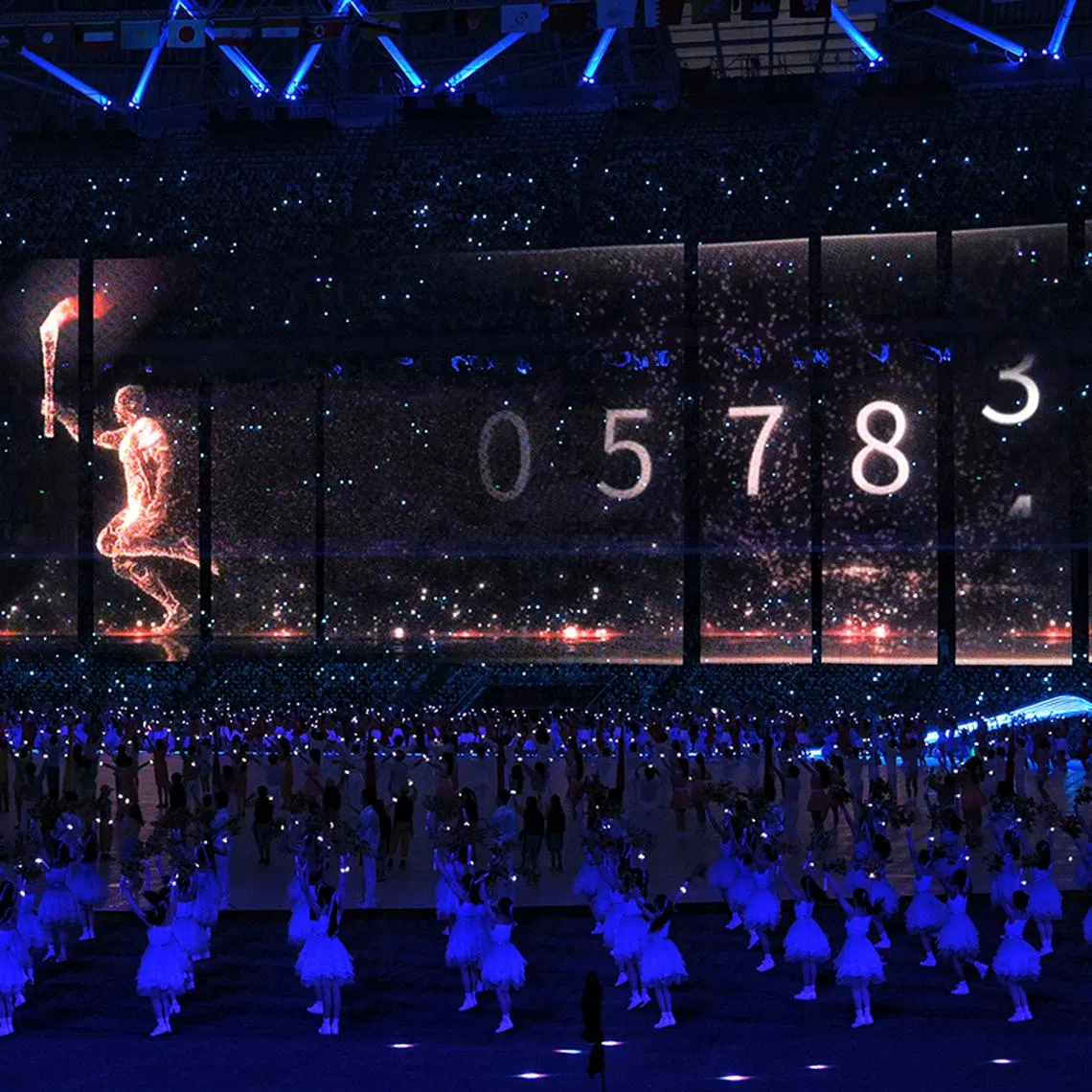A digital torch bearer is seen during the lighting of the cauldron during the opening ceremony of the 19th Asian Games held at the Hangzhou Olympic Sports Center Stadium in Hangzhou, China, on Sept 23, 2023.