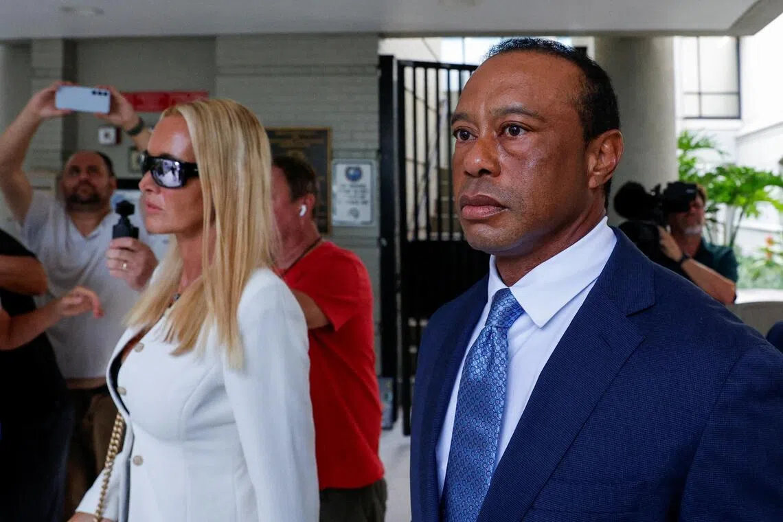 Golfer Tiger Woods (right), seen here leaving a court hearing on Sept 2 with his girlfriend Vanessa Trump, won the Players Championship twice, in 2001 and 2013.