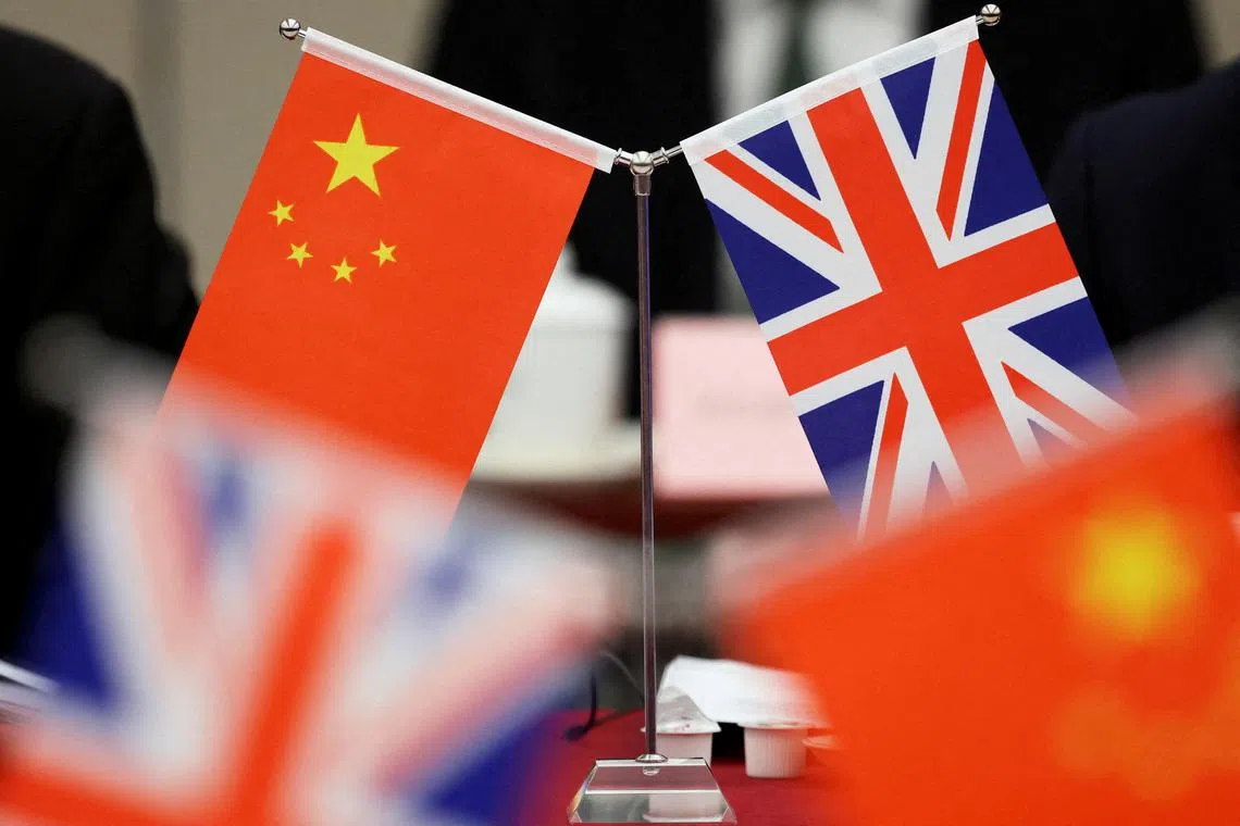 FILE PHOTO: Flags of China and the Union Jack stand during the China-UK Energy Dialogue in Beijing, China March 17, 2025. REUTERS/Florence Lo/Pool/File Photo