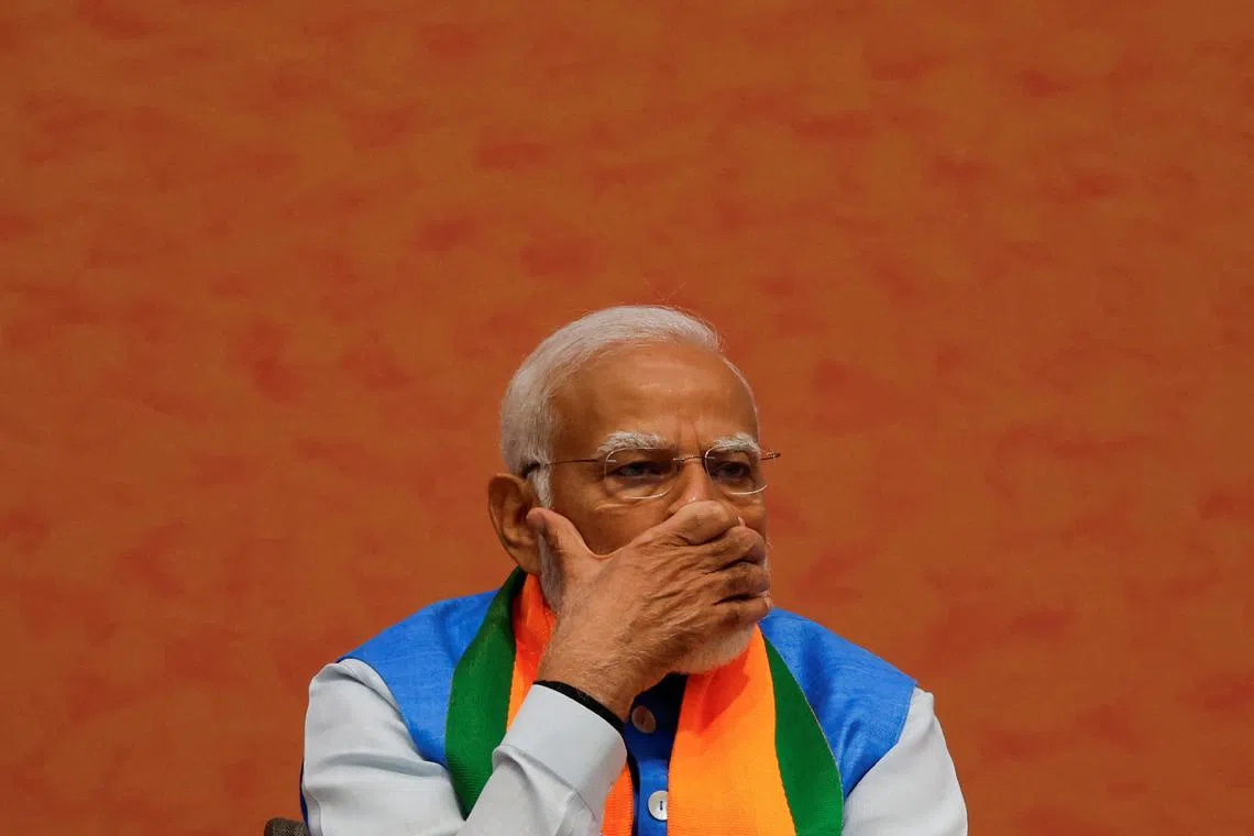 Indian Prime Minister Narendra Modi looks on during an event to launch the ruling Bharatiya Janata Party's (BJP) election manifesto for the general election, in New Delhi, India, April 14, 2024. REUTERS/Adnan Abidi