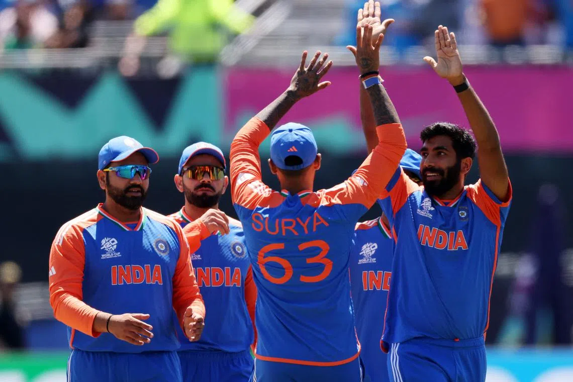 Cricket - ICC T20 World Cup 2024 - Group A - India v Pakistan - Nassau County International Cricket Stadium, New York, United States - June 9, 2024 India's Jasprit Bumrah celebrates with team mates after taking the wicket of Pakistan's Babar Azam REUTERS/Andrew Kelly