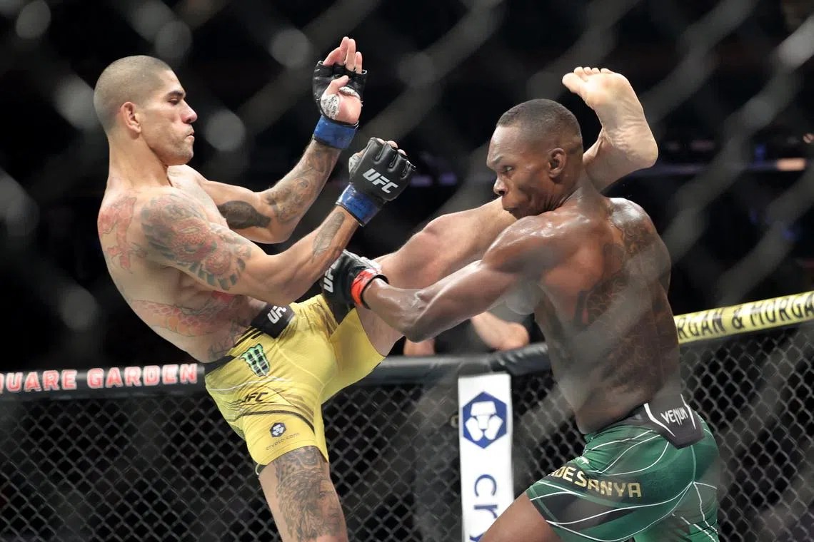 Alex Pereira (left) and Israel Adesanya during UFC 281.