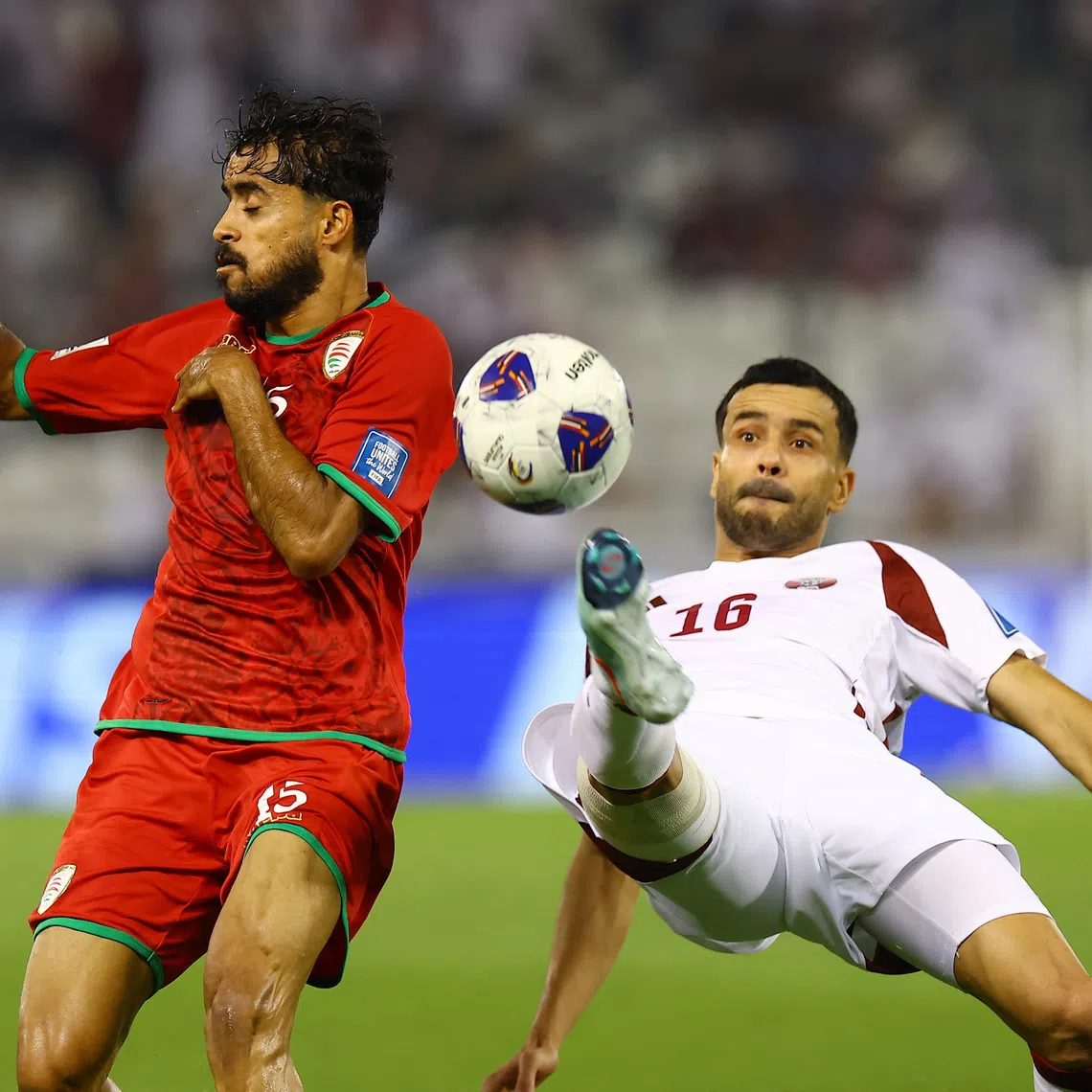 Soccer Football - FIFA World Cup - AFC Qualifiers - Group A - Oman v Qatar - Jassim Bin Hamad Stadium, Doha, Qatar - October 8, 2025 Qatar's Boualem Khoukhi in action with Oman's Nasser Al Rawahi REUTERS/Ibraheem Al Omari