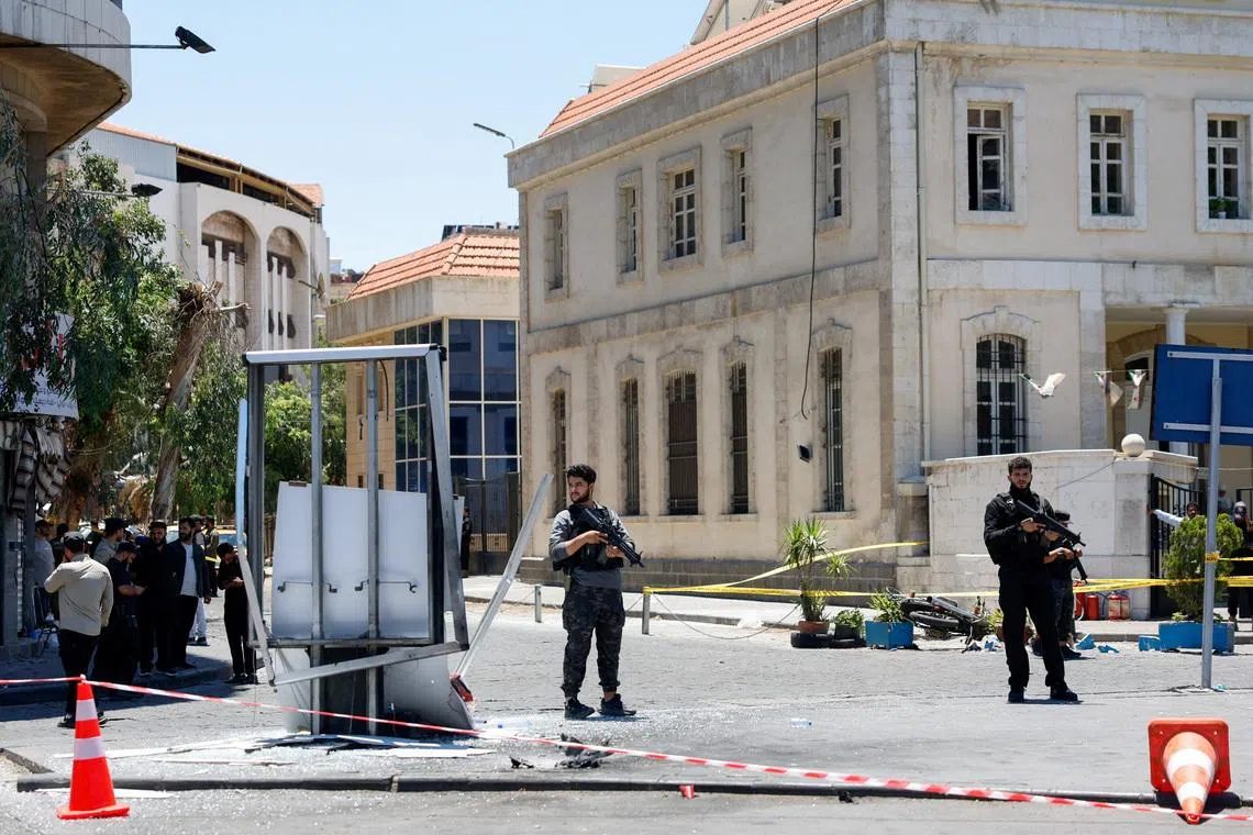 A cordoned-off area and a damaged structure in the aftermath of explosions near a hotel where French President Emmanuel Macron was meant to be staying, in Damascus, Syria, July 7, 2026. REUTERS/Yamam Al Shaar