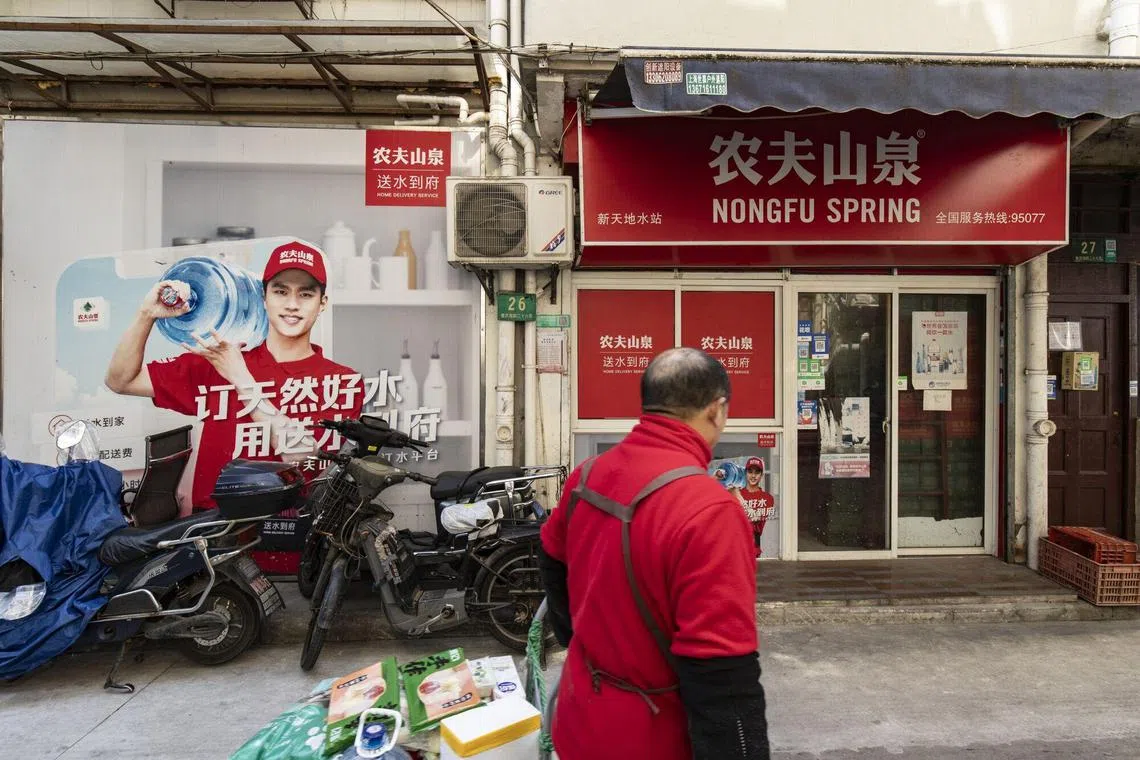 A Nongfu Spring Co. store in Shanghai, China, on Wednesday, March 13, 2024. Chinese beverage giant Nongfu Spring is the latest major brand to come under fire from the mainland’s online army of nationalist citizens, underscoring challenges for domestic firms navigating an increasingly patriotic environment. Photographer: Qilai Shen/Bloomberg