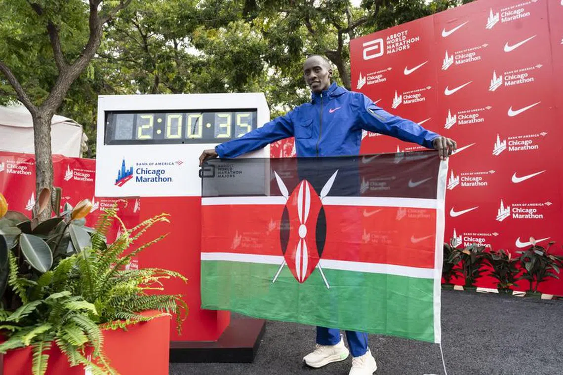 Oct 8, 2023; Chicago, IL, USA; Kelvin Kiptum (KEN) celebrates after finishing in a world record time of 2:00:35 to win the Chicago Marathon at Grant Park. Mandatory Credit: Patrick Gorski-USA TODAY Sports