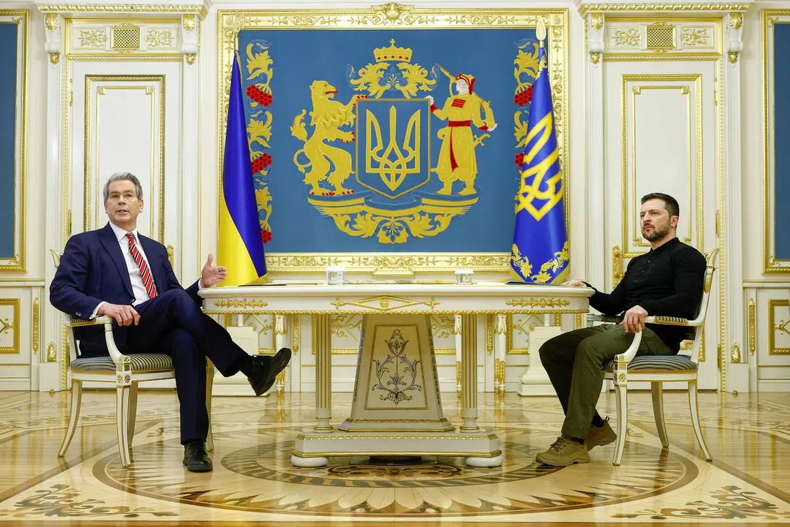 FILE PHOTO: Ukraine's President Volodymyr Zelenskiy and U.S. Secretary of the Treasury Scott Bessent attend a meeting, amid Russia's attack on Ukraine, in Kyiv, Ukraine, February 12, 2025. REUTERS/Valentyn Ogirenko/File Photo
