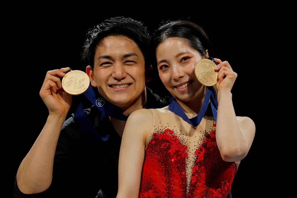 FILE PHOTO: Figure Skating - ISU World Championships - TD Garden, Boston, Massachusetts, U.S. - March 27, 2025  Gold medallists Japan's Riku Miura and Ryuichi Kihara celebrate after winning the pairs REUTERS/Brian Snyder/File Photo