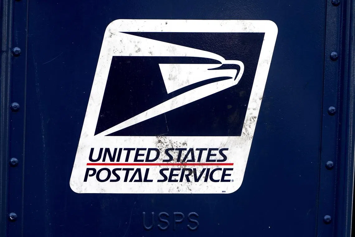 FILE PHOTO: A U.S. Postal Service (USPS) logo is pictured on a mail box in the Manhattan borough of New York City, New York, U.S., August 21, 2020. REUTERS/Carlo Allegri/File Photo