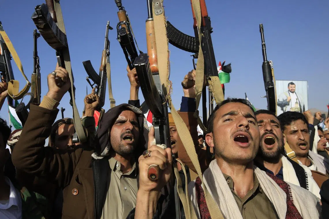 People protested in Yemen following US and UK airstrikes on Houthis military sites on Jan 12.