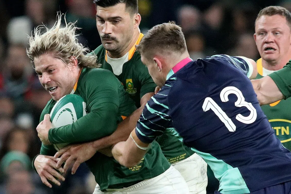 South Africa's Faf de Klerk is tackled by Ireland's Garry Ringrose during the Autumn International friendly match in Dublin on Nov 5, 2022.