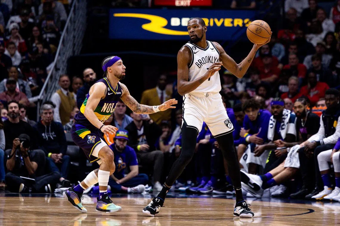 Brooklyn Nets forward Kevin Durant looks to pass the ball against New Orleans Pelicans guard Jose Alvarado during the second half at Smoothie King Centre.