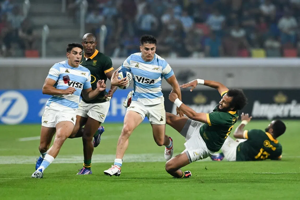 Argentina fly-half Tomas Albornoz evading South Africa scrum-half Jaden Hendrikse during the Rugby Championship match at the Estadio Unico Madre de Ciudades in Santiago del Estero on Sept 21. Los Pumas' 29-28 win keeps the title race open.