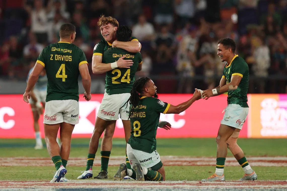 FILE PHOTO: Rugby Union - HSBC Sevens World Championships - Men's Cup Final - South Africa v Argentina - Hong Kong - Kai Tak Sports Park, Hong Kong, China - April 19, 2026 South Africa players celebrate after winning the Men's Cup Final REUTERS/Tyrone Siu/File Photo