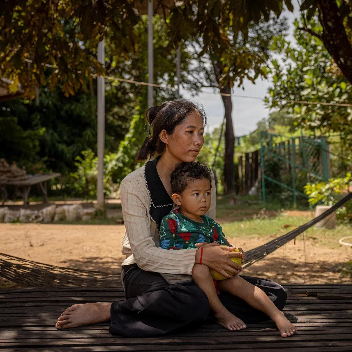 Kruoch Ya with her son Ros Soveayo in Prey Thom Village in Siem Reap, Cambodia, Oct. 22, 2025. Her husband, Hong Chanvimean, is one of the prisoners of war. In President Donald Trump, families of Cambodian troops detained by Thailand see hope and are expecting he will do for their loved ones what he did for the hostages held by Hamas: set in motion a plan that leads to their release. (Lauren DeCicca/The New York Times)