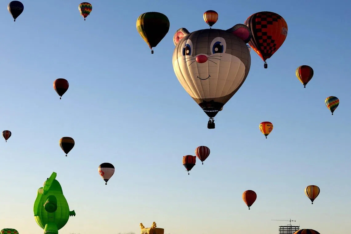 Hot air balloons flying during the third day of the 21st International Hot Air Balloon Festival in Mexico on Nov 19, 2023.