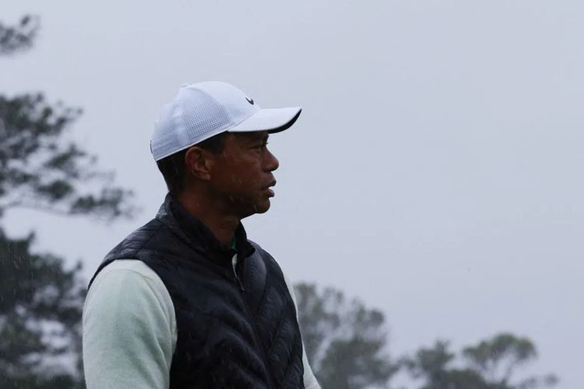 FILE PHOTO: Golf - The Masters - Augusta National Golf Club - Augusta, Georgia, U.S. - April 8, 2023 Tiger Woods of the U.S. reacts on the 18th green during the second round REUTERS/Brian Snyder/File Photo