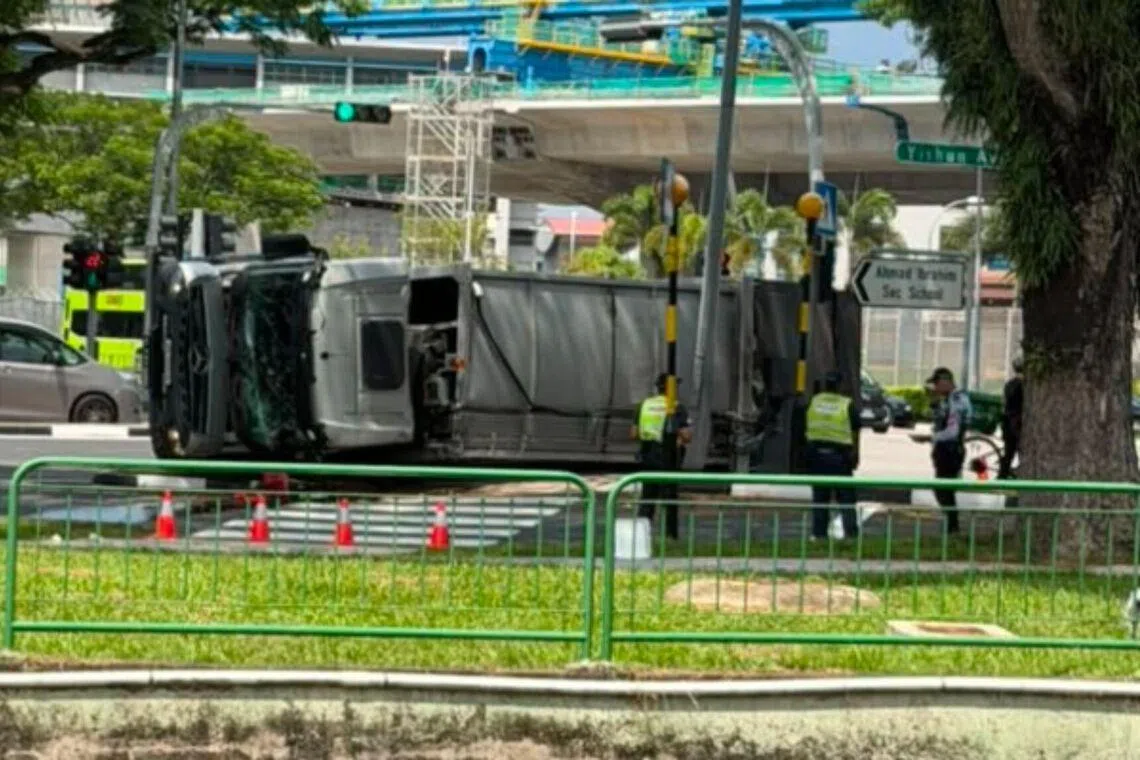 Three workers taken to hospital after garbage truck skids and flips over in Yishun