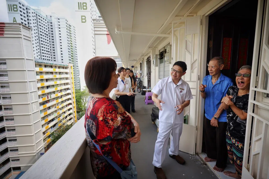 PAP newcomer Foo Cexiang meeting residents during house visits as he campaigns in Bukit Merah on April 29.