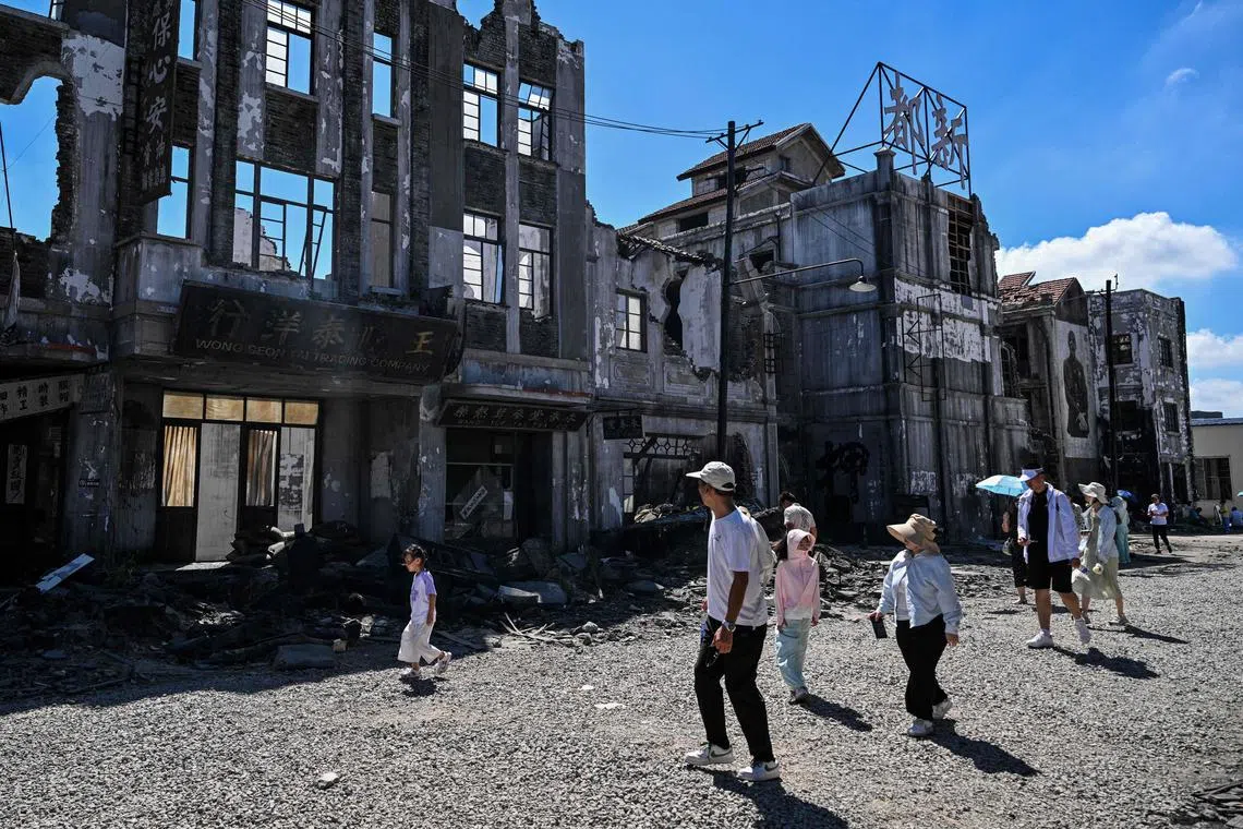 Visitors at the set where Chinese blockbuster Dead to Rights was filmed at the Shanghai Film Park on Aug 27.