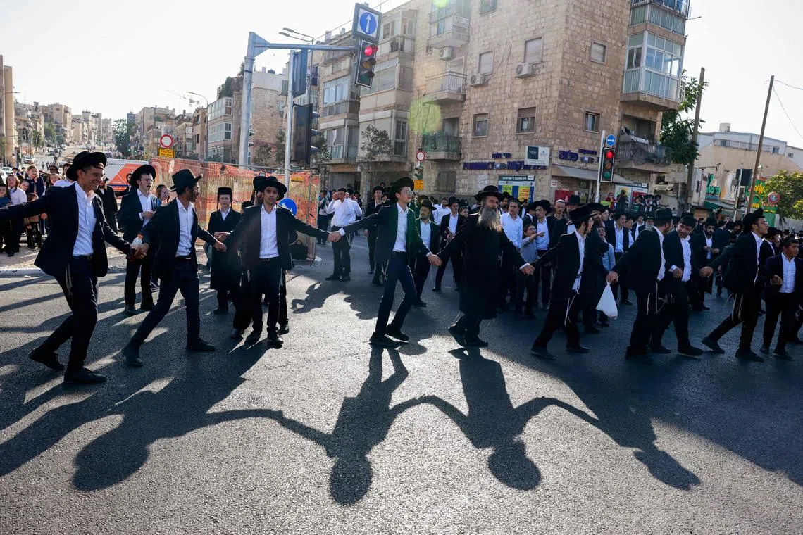 Ultra-Orthodox Jewish protesting against their conscription in Israel’s military, as well as against the arrest of religious school students who avoided draft orders, during a rally in Jerusalem on Aug 7, 2025. 