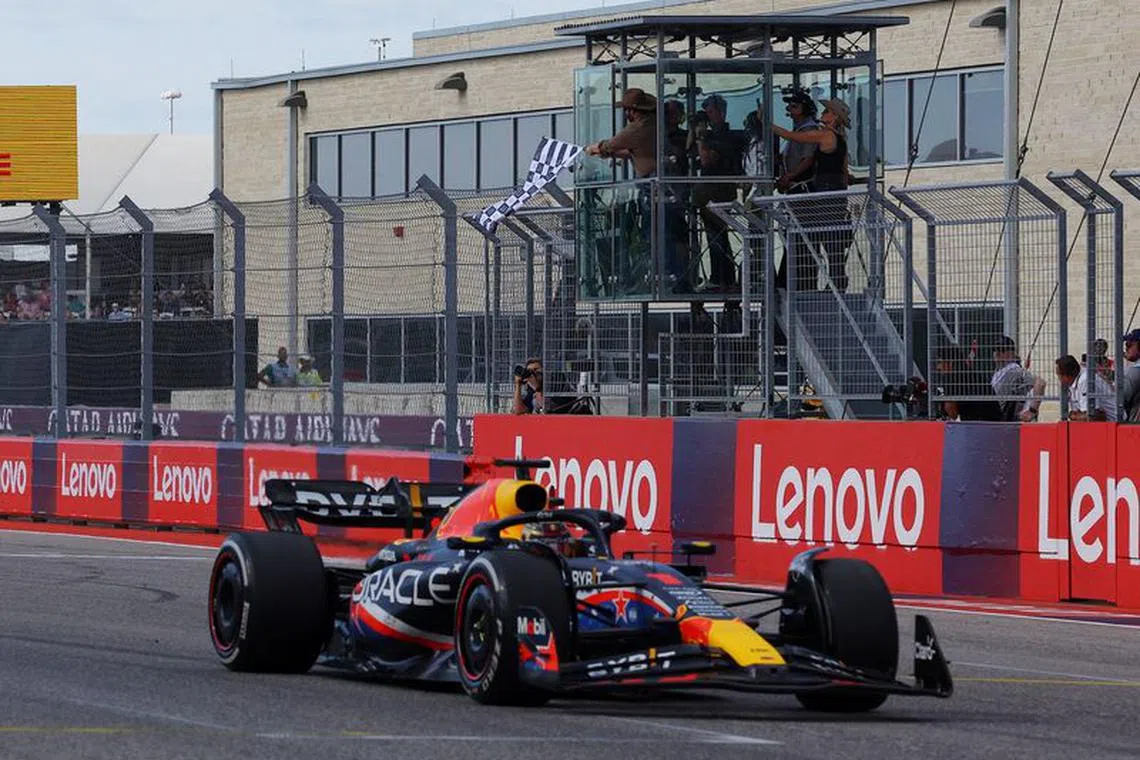 Formula One F1 - United States Grand Prix - Circuit of the Americas, Austin, Texas, U.S. - October 22, 2023 Red Bull's Max Verstappen takes the chequered flag to win the race REUTERS/Brian Snyder