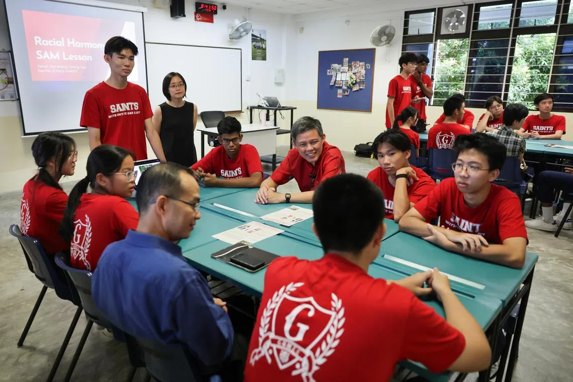 Minister for Education Mr Chan Chun Sing interacts with St Andrew's Junior College's JC1 students during the Character and Citizenship Education lesson on Racial Harmony Day, on July  19, 2024.