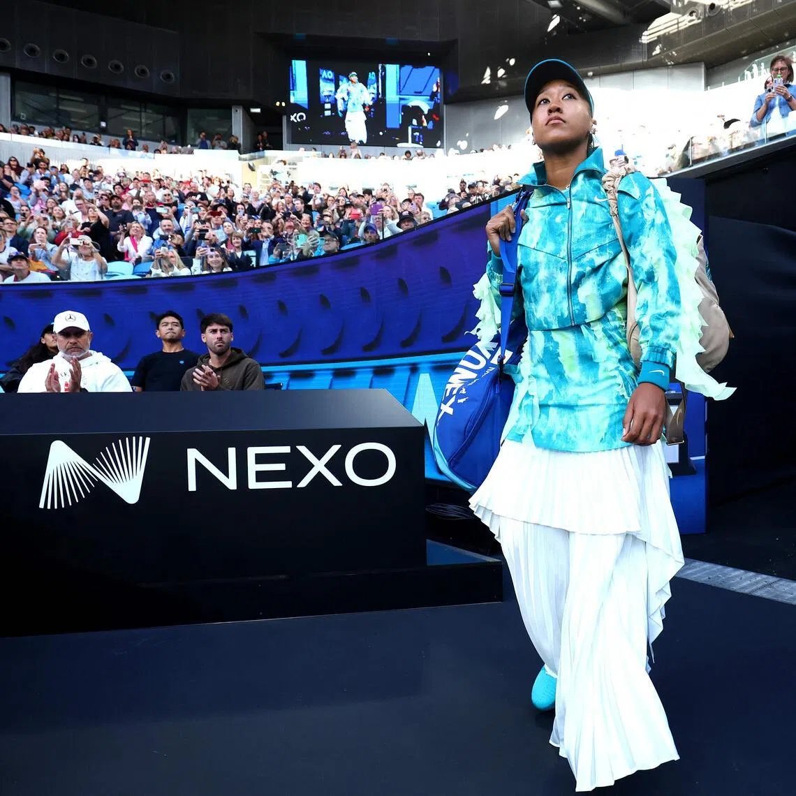 Japan's Naomi Osaka walks on the court to face Romania's Sorana Cirstea at the Australian Open.