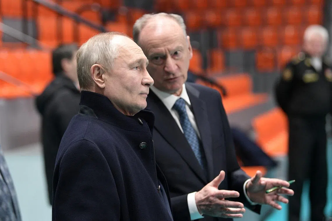 Russian President Vladimir Putin listens to Security Council's Secretary Nikolai Patrushev as they visit a sports hall of the St. Petersburg State Marine Technical University in the city of Saint Petersburg, Russia, January 26, 2024. Sputnik/Alexei Danichev/Pool via REUTERS/File Photo