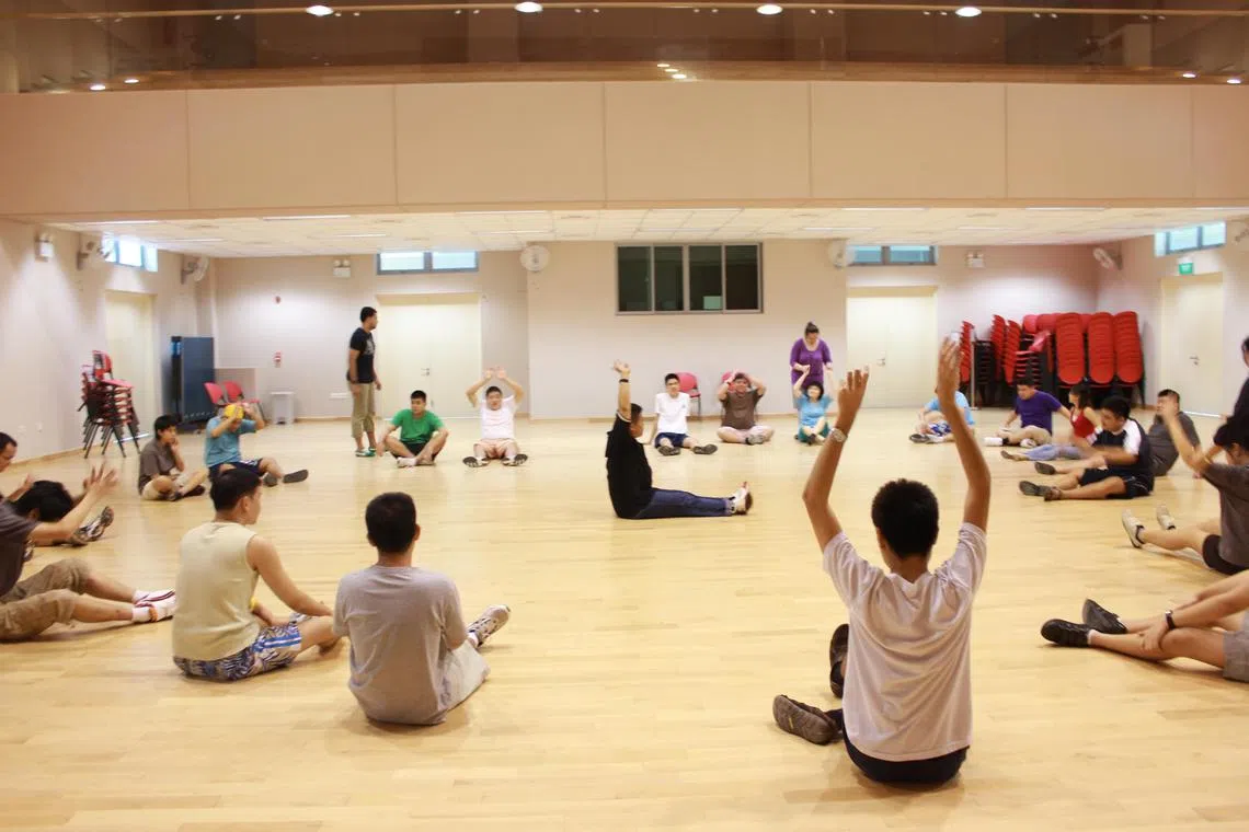 Young people with autism doing physical exercises at the St Andrew’s Autism Centre (SAAC) day-activity centre. 