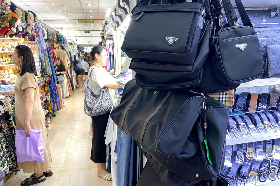 Counterfeit products are displayed at a shop inside a shopping mall in Ho Chi Minh City, Vietnam.