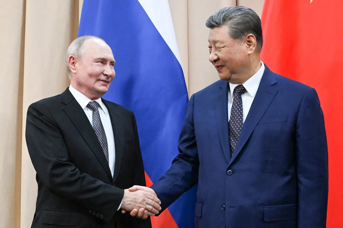 China's Xi tells Putin that foundations of ties will be stronger