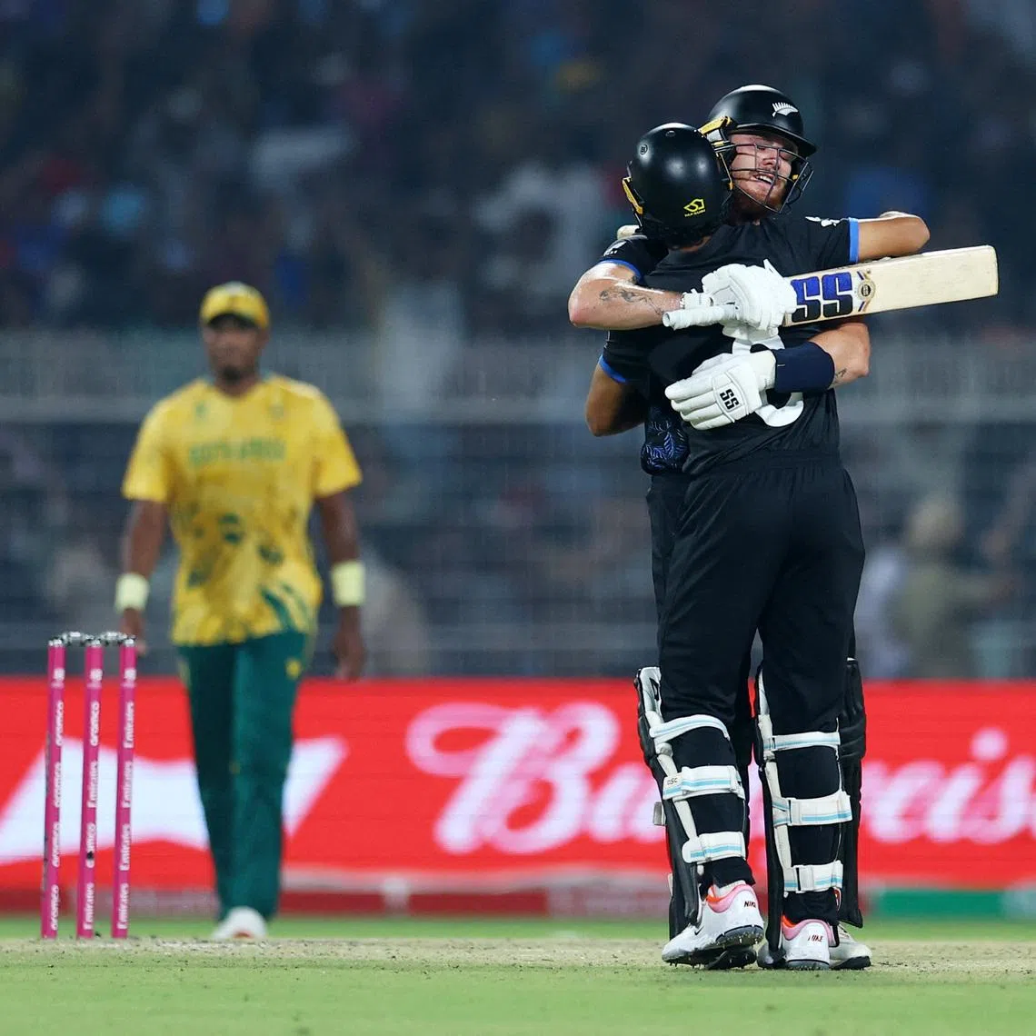 Cricket - ICC Men's T20 World Cup 2026 - Semi Final - South Africa v New Zealand - Eden Gardens, Kolkata, India - March 4, 2026 New Zealand's Finn Allen and Rachin Ravindra celebrate after the match REUTERS/Anushree Fadnavis