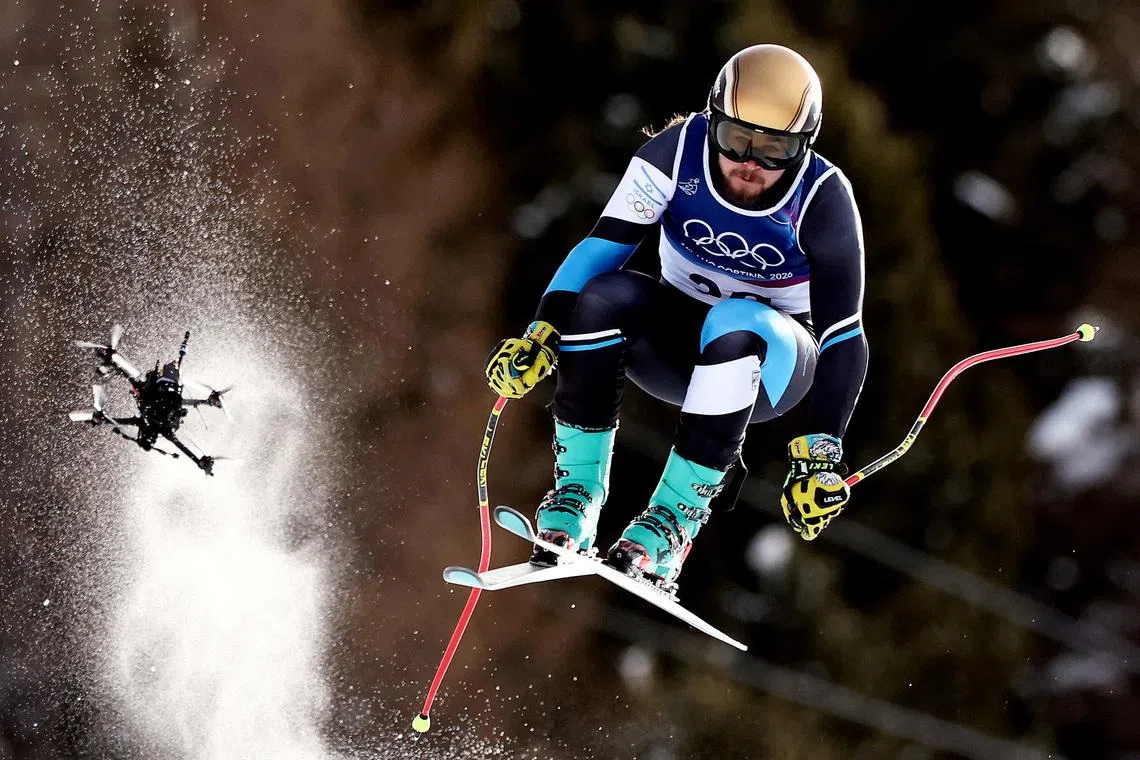 FILE PHOTO: Milano Cortina 2026 Olympics - Alpine Skiing - Men's Downhill - Stelvio Ski Centre, Bormio, Italy - February 07, 2026. Barnabas Szollos of Israel in action during the Men's Downhill as a drone is seen REUTERS/Christian Hartmann/File Photo