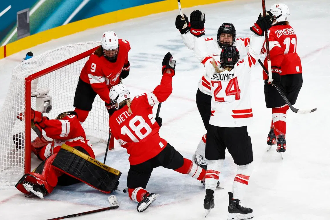 Milano Cortina 2026 Olympics - Ice Hockey - Women's Preliminary Round - Group A - Switzerland vs Canada - Milano Rho Ice Hockey Arena, Milan, Italy - February 07, 2026. Natalie Spooner of Canada celebrates scoring their first goal against Switzerland with Marie-Philip Poulin of Canada REUTERS/Alessandro Garofalo