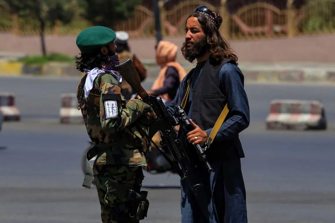 Taliban security stand guard at a roadside checkpoint in Kabul on Jan 2, 2023.