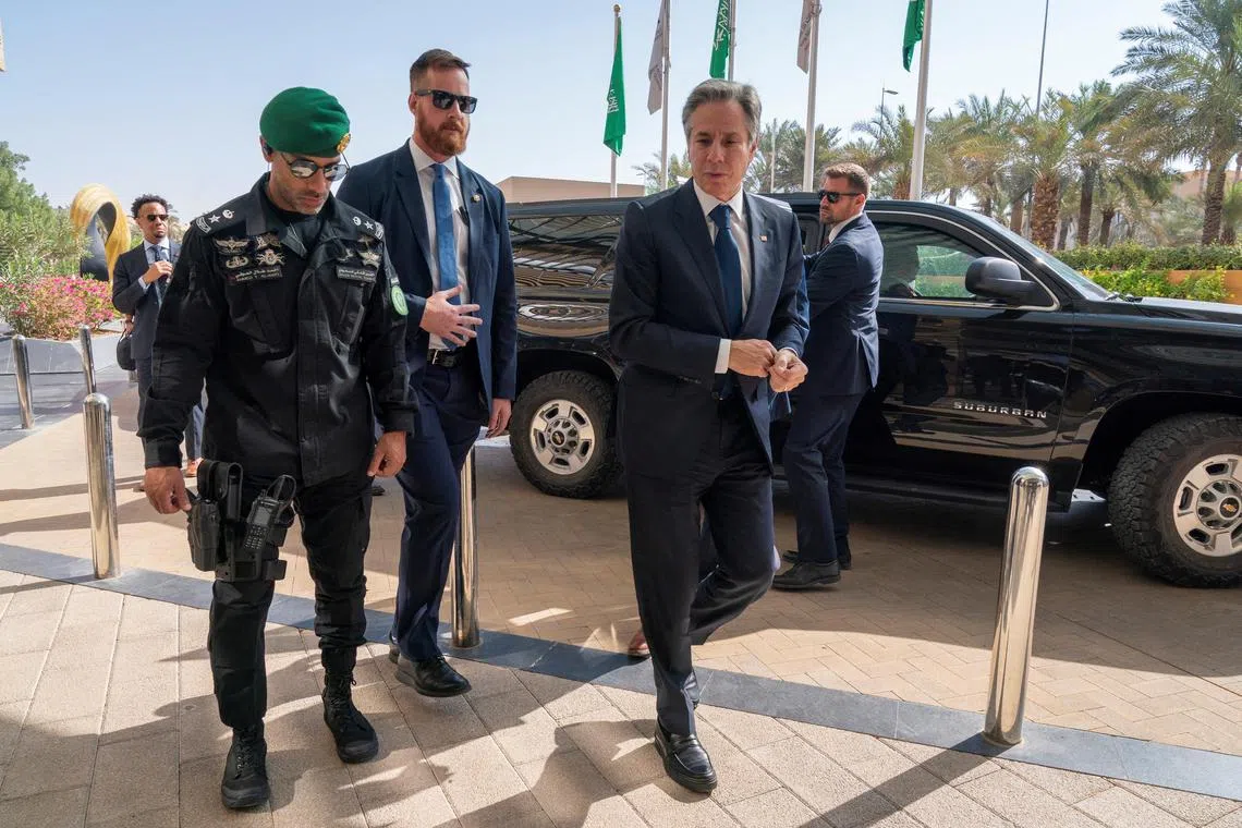 US Secretary of State Antony Blinken (second from right) returns to his hotel after meeting with Saudi Crown Prince Mohammed bin Salman.